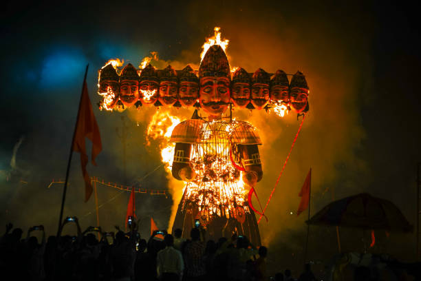 Ravan Dahan, according to Hindu culture, Effigies of Ravana are burned on Vijayadashami, in India at many places, Ravana burning in dussehra festival, crowd or people taking picture with smartphone